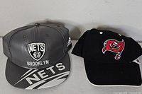 Front view showing both hats side by side