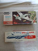 Both model kit boxes closed, showing titles and artwork