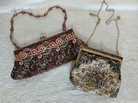 Both clutches front view showing overall styles, frames and straps
