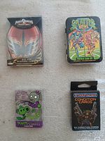 Group shot of all four sealed card packs