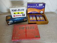 Group shot of five boxed golf ball sets