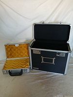 Both cases open showing interiors