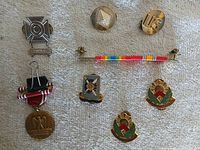 Overall view of all insignia and medals in lot