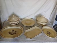 Full view of six Pfaltzgraff Village serving pieces