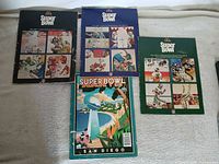 All four Super Bowl programs front covers visible