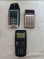 Overview of all three calculators and Commodore case