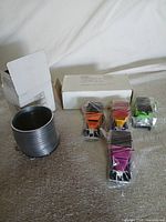 Slinky, boxed and four sealed Model T cars grouped