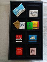 Tray showing all matchbooks arranged in two columns