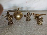 Group shot of all five brass miniatures