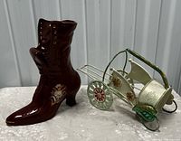 Overall view showing ceramic boot vase and metal wine bottle cart