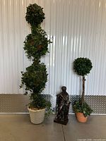 Full view of both topiaries and statue