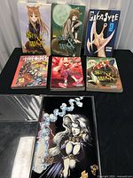 Comic in hard case and all books laid out