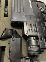 Camcorder body with lens seated in foam case