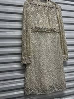 Full view of front of lace beaded wedding dress