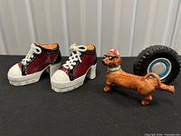 Pair of sneaker shakers with dachshund and tire shakers