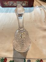 full view of crystal bell standing upright