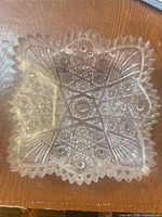 Top view of clear crystal square bowl showing entire pattern and sawtooth rim