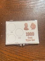 Front view showing insert graphics and three coin slots