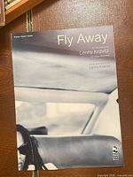 Front cover showing title, artist and publisher logo