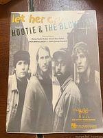 Front cover showing title, band photo, arrangement type, publishers