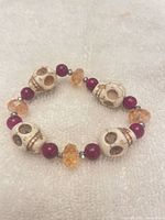 Bracelet front view showing skull, round and faceted beads