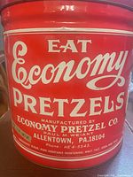Front view showing Eat Economy Pretzels graphics and maker information
