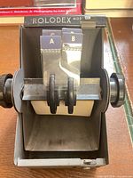 Front view of Zephyr Rolodex showing knobs, interior card holder, A-B tabs
