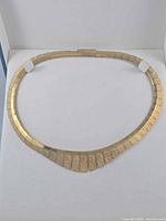 Necklace laid flat showing overall design