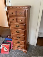 Front angled view of wooden 7-drawer dresser showing hardware and finish