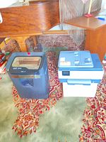 Printer and shredder shown together on floor