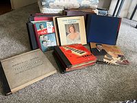 Overall lot showing stacks of album binders and LPs on carpet