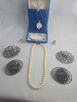 Group shot of all eight jewellery pieces