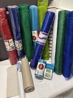 Full group showing all mesh rolls and cupboard liner on table