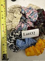 Scrunchies laid next to tape for scale