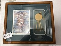 Full view of framed shadow box showing print and leather drum