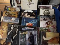 Front view of all CD cases in lot