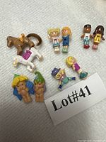 Group of all Polly Pocket figures and horses with lot tag