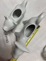 Top view of both cow creamers showing openings