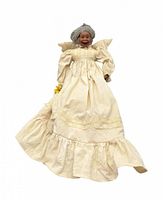 Front view of porcelain grandmother doll in cream gown
