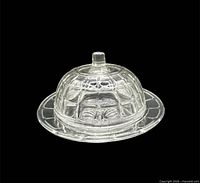 Full view of covered butter dish showing dome lid and base