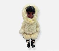 Front view of Carlson Inuit doll showing rabbit fur parka, face, boots