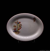 Front view of Edwin Knowles Tia Juana oval platter on stand