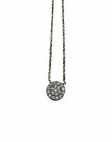 Close-up of pavé disc pendant on chain