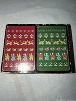 Inner case lid with red and green folk-motif sample cards