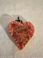 front view showing floral design and shape