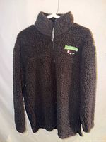 Front view of black sherpa fleece quarter-zip sweatshirt