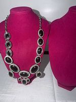 Full view of necklace on bust showing overall design