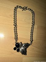 Full view showing chain style, toggle clasp, leaf pendant and stones