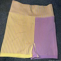 Front view of striped athletic shorts showing color pattern and waistband