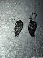 Front view of both earrings showing filigree leaf design and marcasite stones